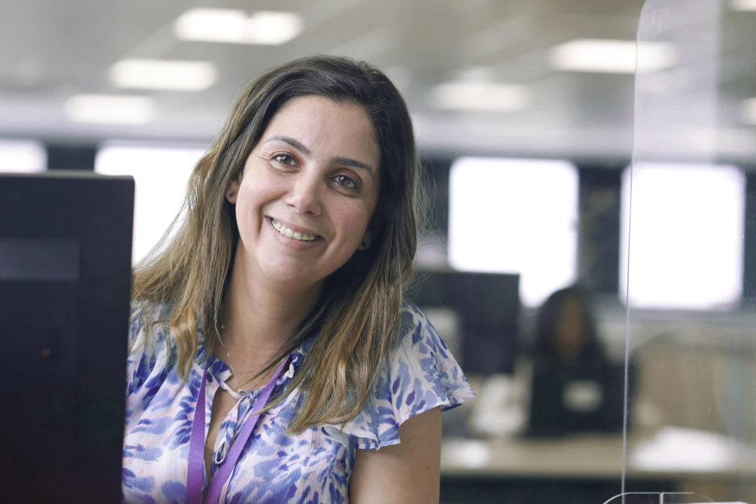 Female Sanofi team member at her computer