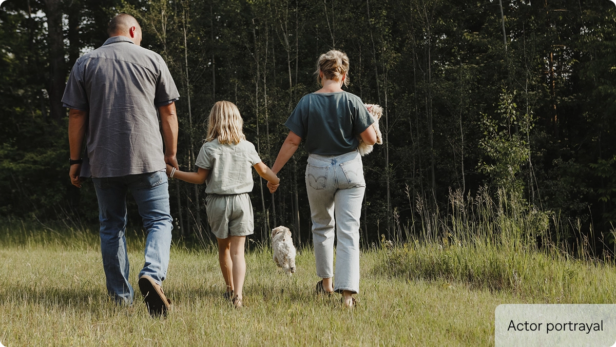 A family and dog in the forest