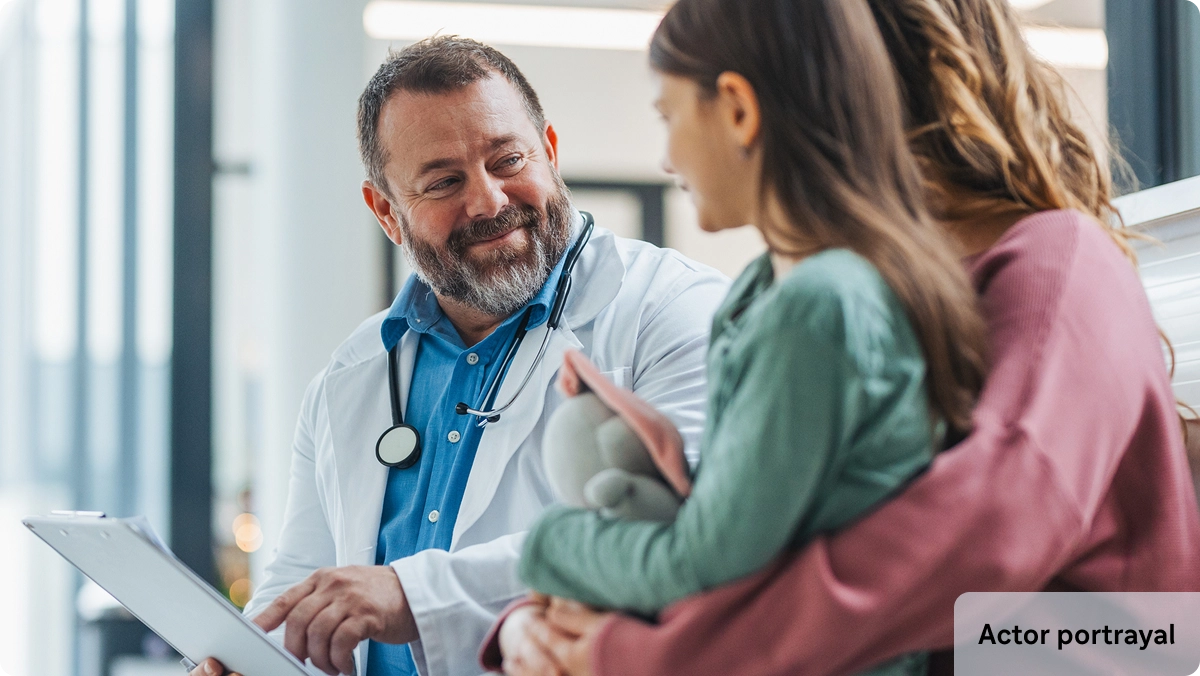 Doctor with woman and daughter