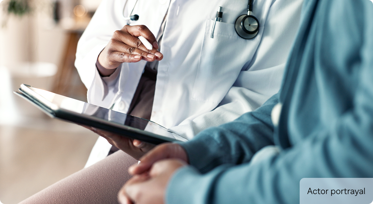 Actor portrayal of doctor with patient